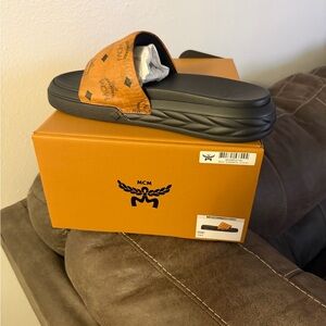 MCM Tan and Black Logo Slides